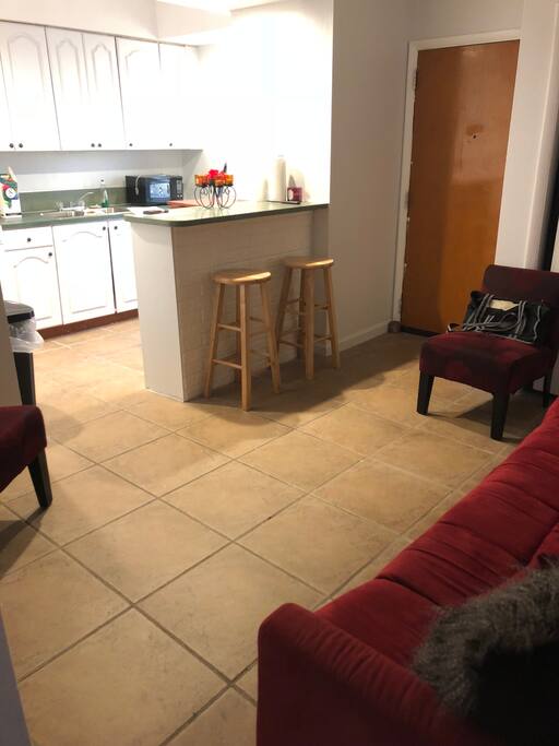 Living room space and kitchen