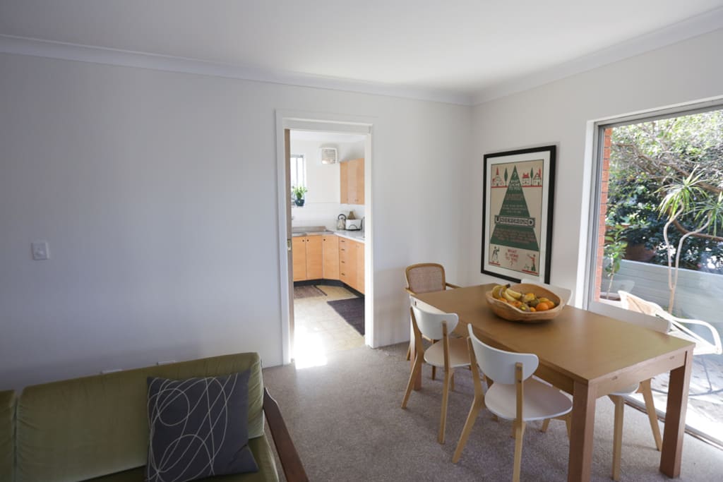 Dining table looking out to balcony and garden