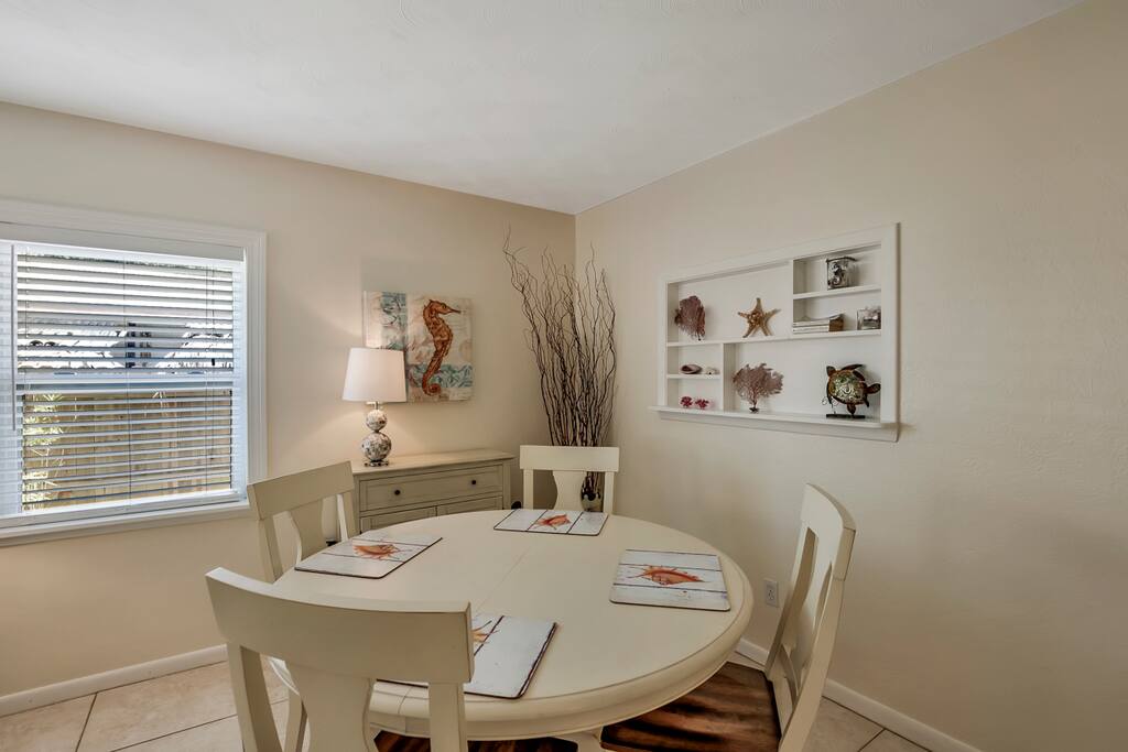 Open dining area includes table expandable to seat six.