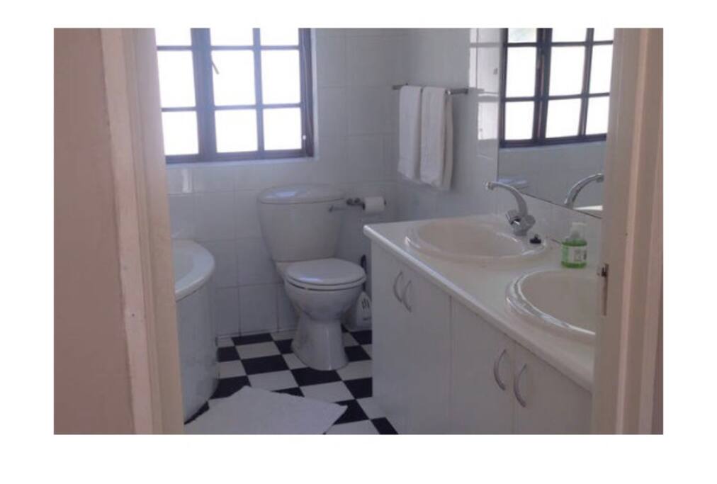 Full ensuite bathroom with shower