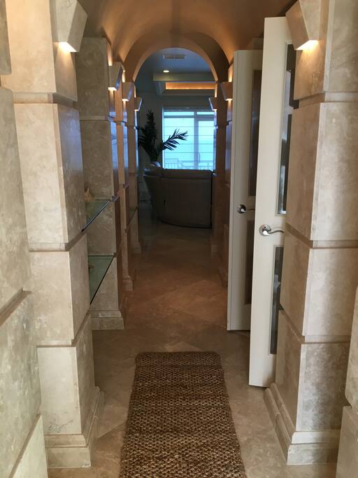 Front door entry with downstairs bedroom on the right and living room ahead