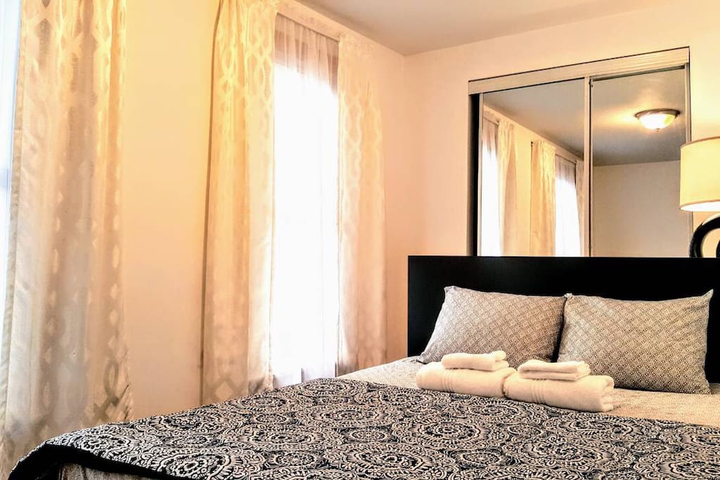 This is exactly how you will find your bedroom upon checking in. Sheets, blanket and towels are provided. Mattress is GREEN TEA MEMORY FOAM. There is a full sized mirror in your room!