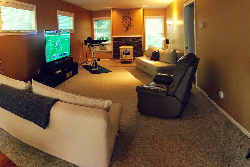 Living room with wood burning stove for cozy winter evenings