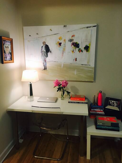 Desk space with a painting of Cy Twombly keeping watch.