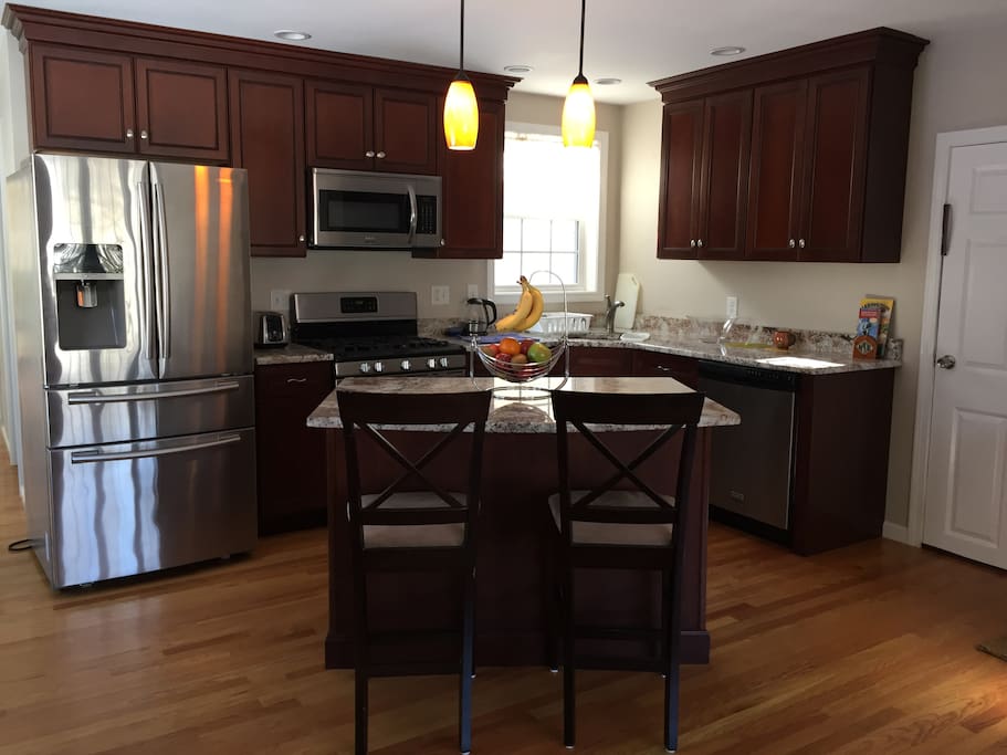 Newly built kitchen with the beautiful bar table island.