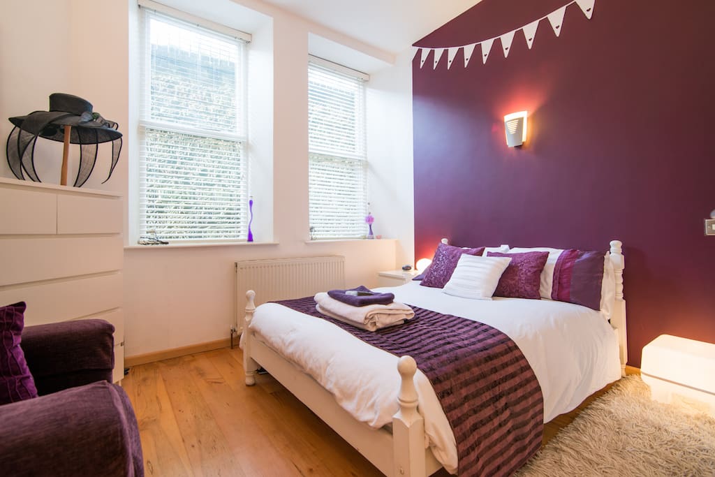 The Aubergine Room with lots of wardrobe space and big comfy bed & TV