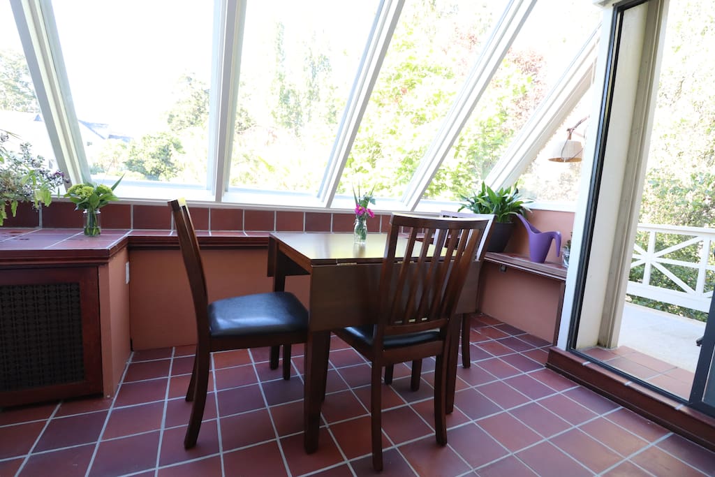 A private, glass covered sun room is ideal for a blissful tea or coffee break - just relax and smell the flowers.