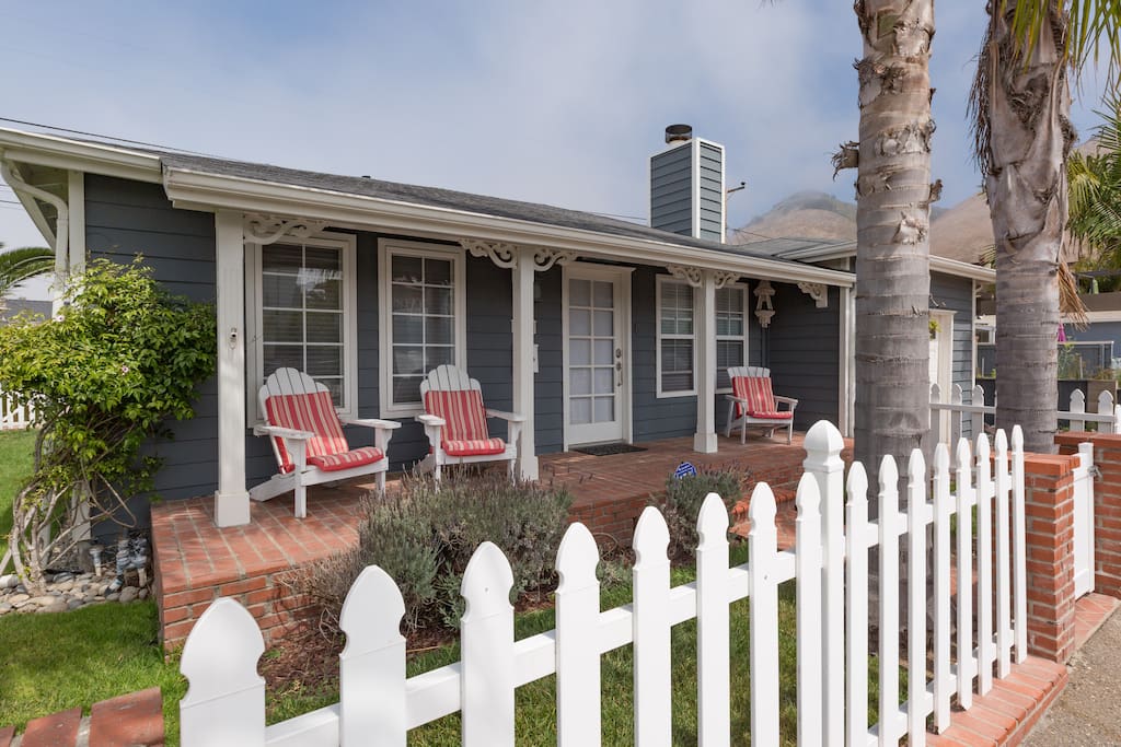 Enjoy relaxing with a glass of wine on the front porch.
