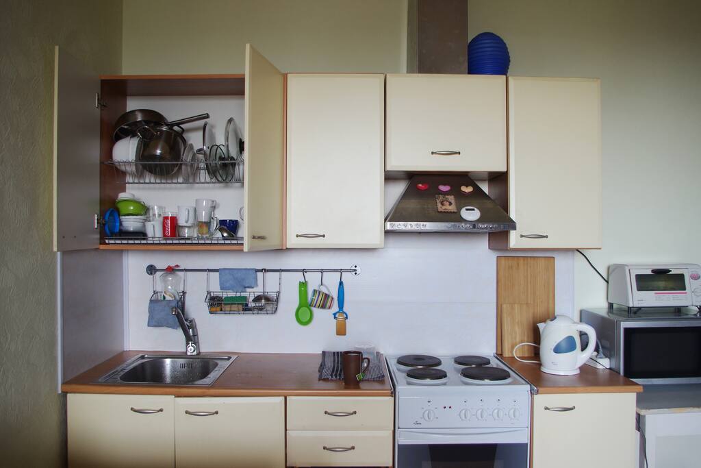There are pots and pans, plates and mugs