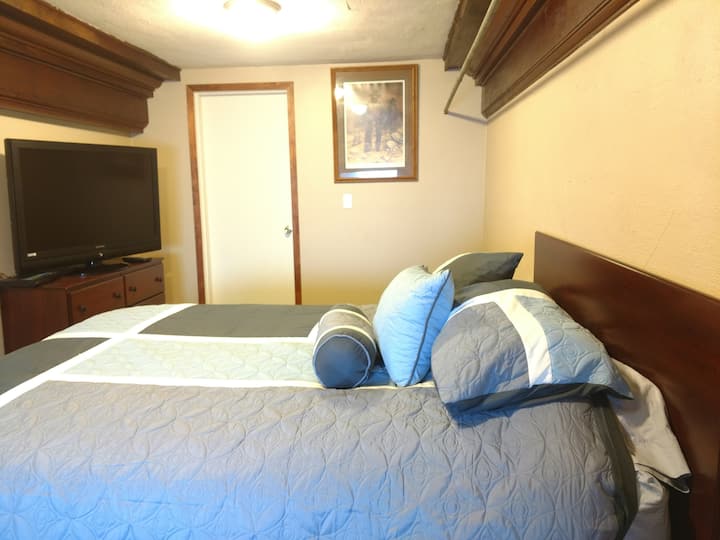 TV & door separating spare bedrooms