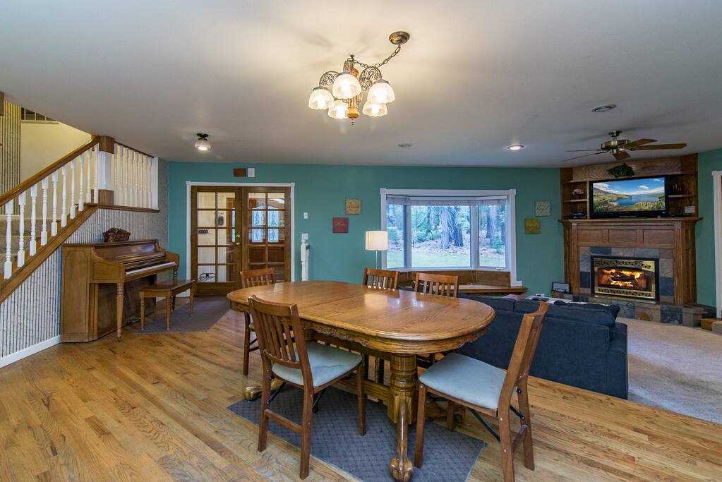 A dining area off the kitchen seats 6 at a handsome wood table.