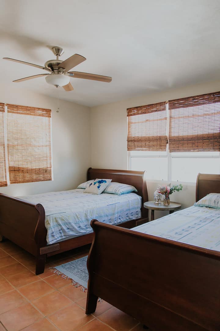 Avocado apartment - 2nd bedroom has 2 queen beds, air conditioning and plenty of space for your clothes.