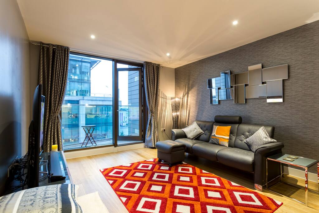 Spacious open plan living room with balcony