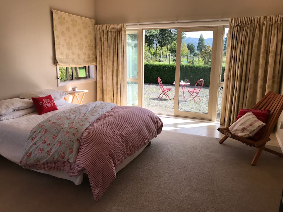 Queen-size bed, French doors to patio (small step from terrace)