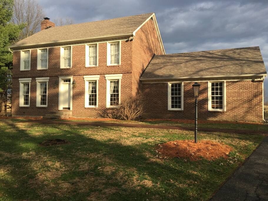 Historical stone steps, brick sidewalks, running bond brick with corbel, deep set windows and flowering shrubs are perfect for photos. Bon fire set up with this view.