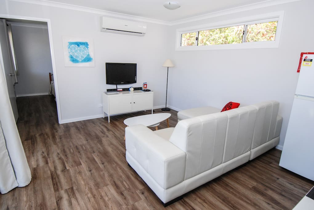 seating area with TV & reverse cycle AC