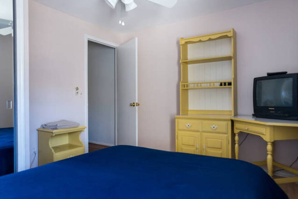 View of door to room with desk and drawers.
