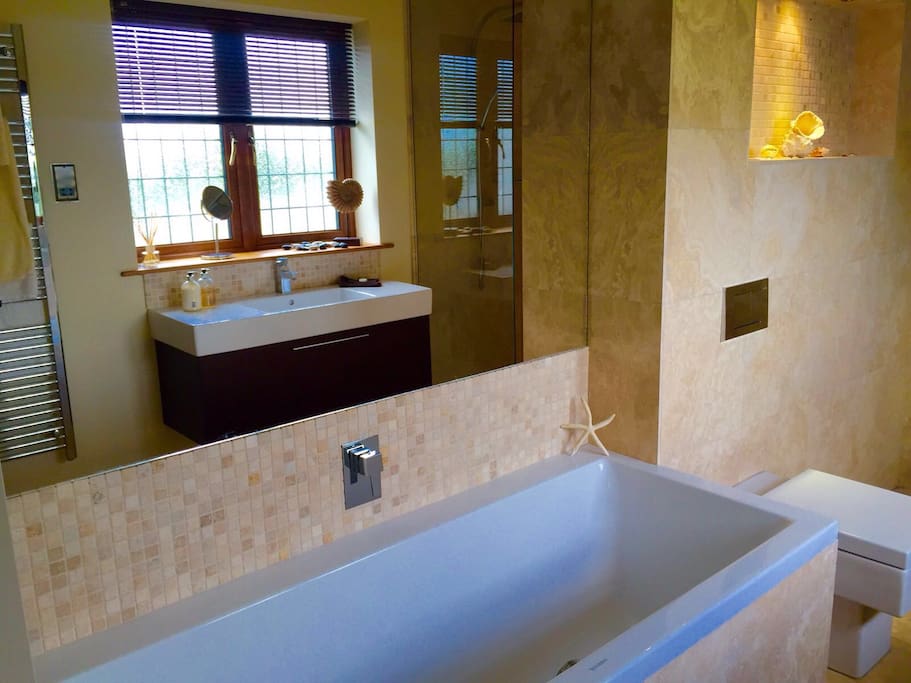 Bathroom with bath and shower