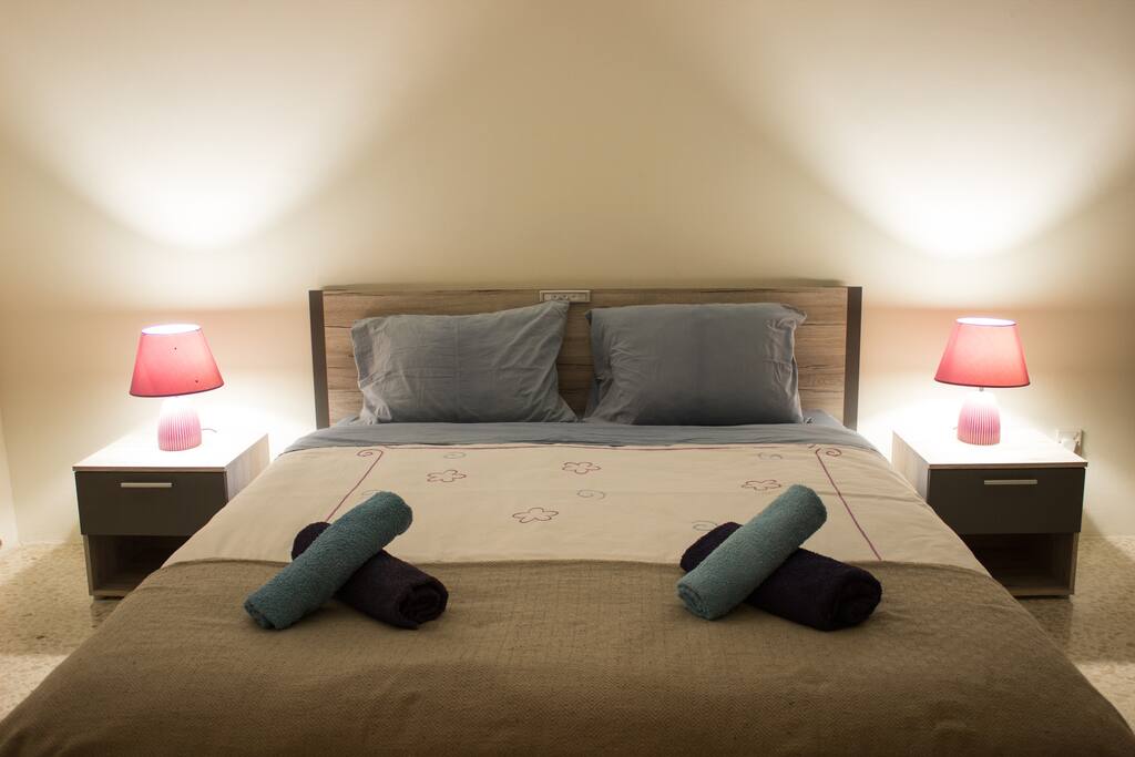Bedroom with luxurious King-Sized Bed (160cm width). Towels are provided.