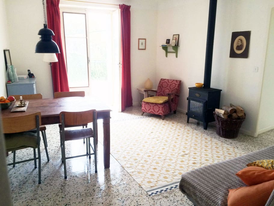 First floor: Living room, doors open to the terrace, wood stove for extra heating