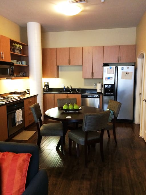Gas stove and stainless steel appliances make this open floor plan kitchen ideal