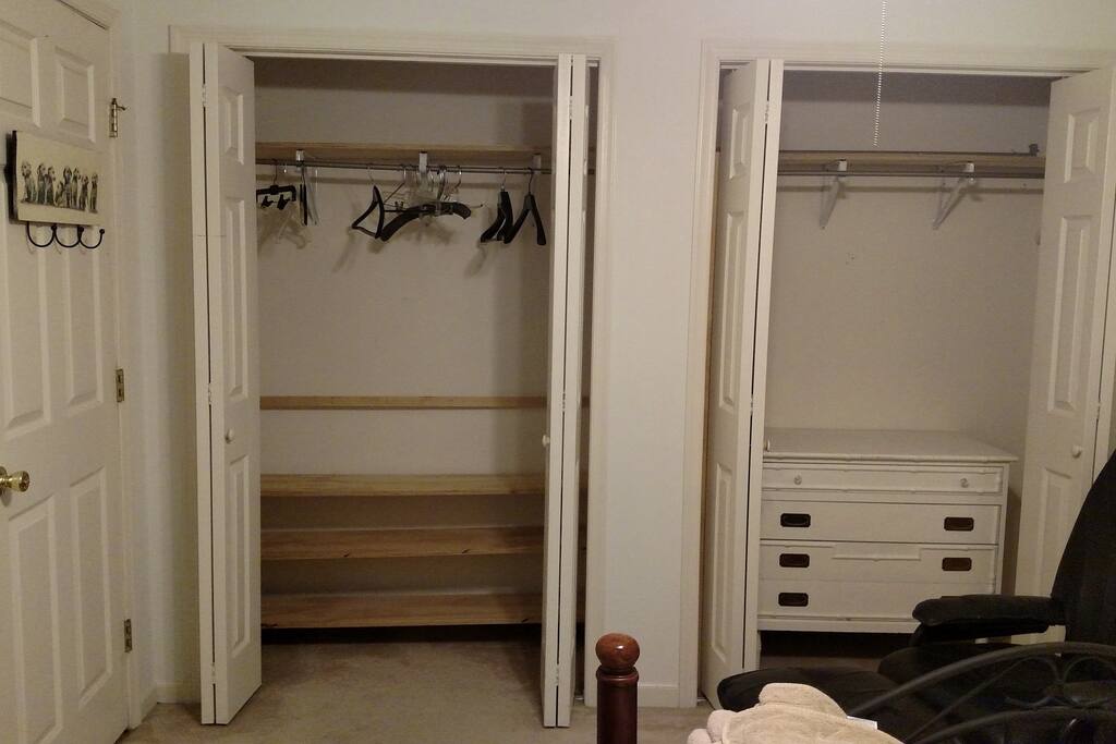 two closets, dresser, hangars, hooks on the back of the door for towels or bathrobe