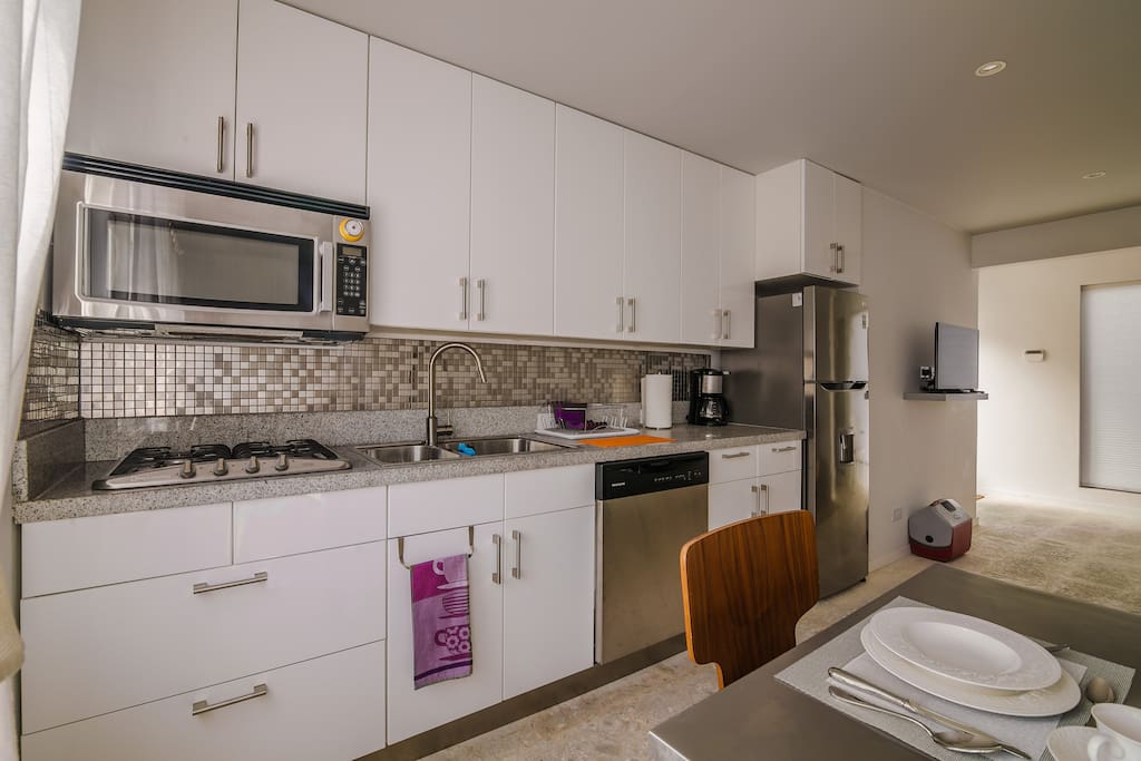 Modern kitchen with gas stove and all appliances