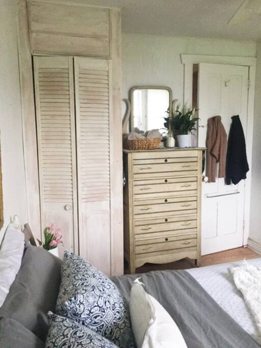 First bedroom, vintage chest & closet space.