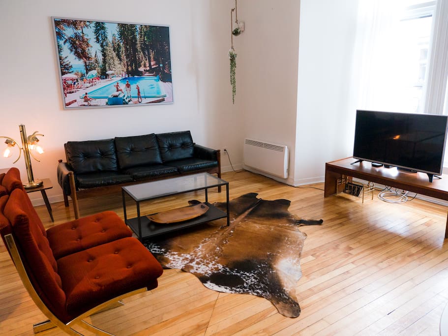funky living room, with a flatscreen TV, appleTV, and Netflix account provided!