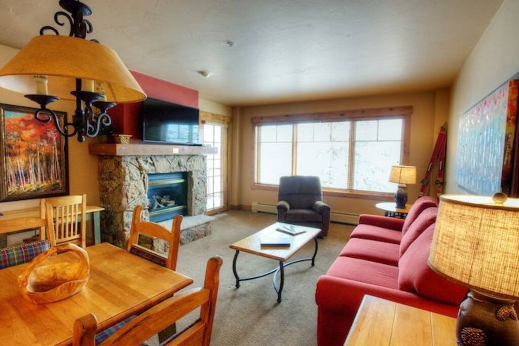 The living area is spacious and the large windows let in lots of natural light