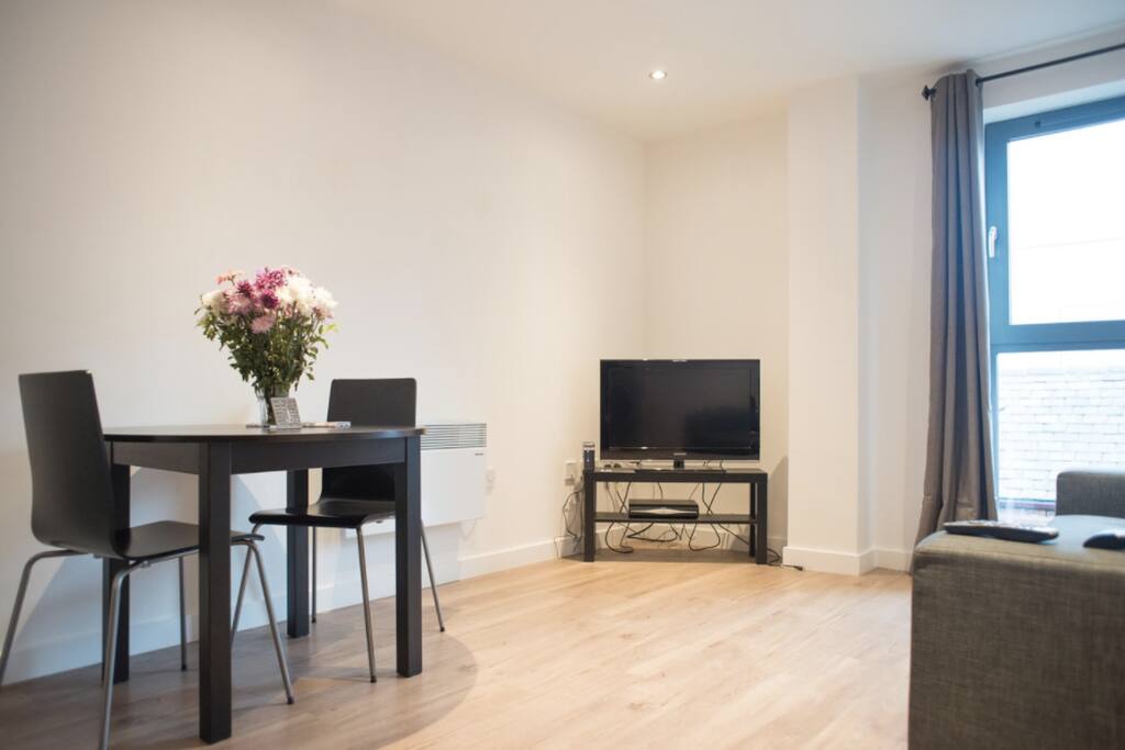 Intimate dining table and living room