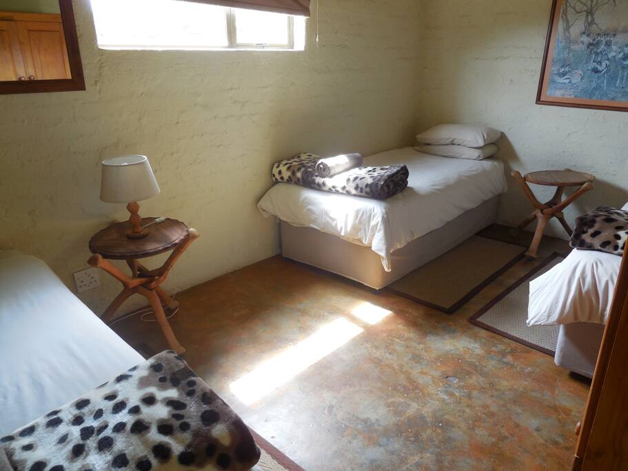 Second bedroom with three single beds