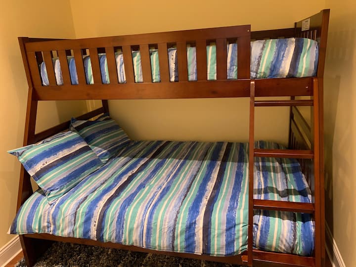 After a day of play, the kids can have their own private room.  Twin over Full, so the bottom memory foam mattress can also accommodate an adult.  *No Closet, but hooks on wall & luggage rack.  Door & window.  Bonus Bedroom, 1st Floor 