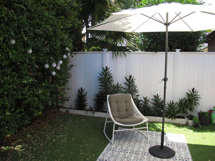 Gorgeous garden surrounded by palm trees and beautiful bird song