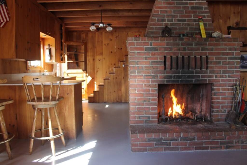 Cozy living room warmed by the late day sun and hearth