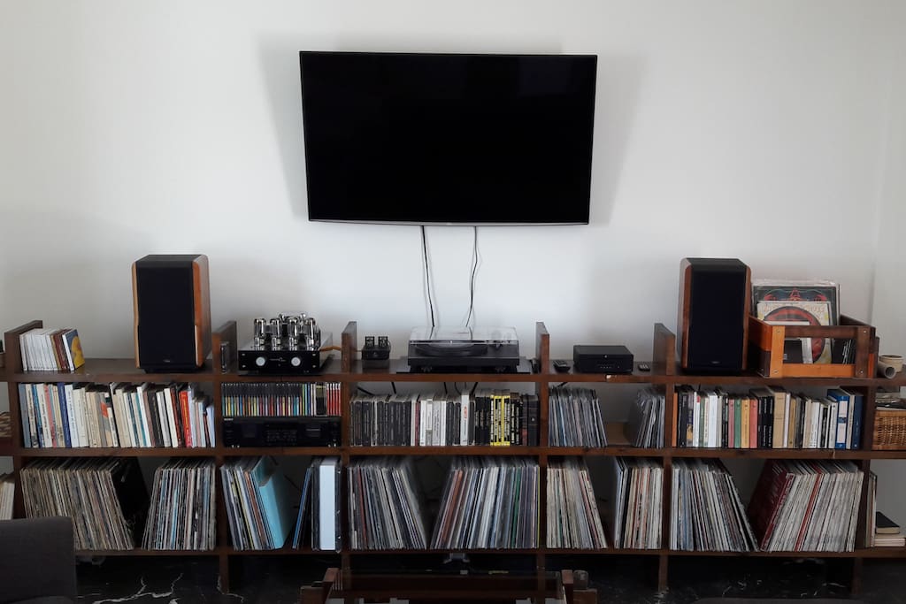 Pro-Ject Debut III upgraded with Ortofon 2M Blue Cartridge, Pro-Ject Phono Stage & CD Player, Tsakiridis Aiolos 2x45W Tube Amplifier, Chario Constellation Delphinus Speakers and Sony Double Tape Deck (you can bring your mixtapes...).
LG 50" WiFi TV with NETFLIX and Spotify subscription plus a collection of books and music that you can enjoy while staying here.