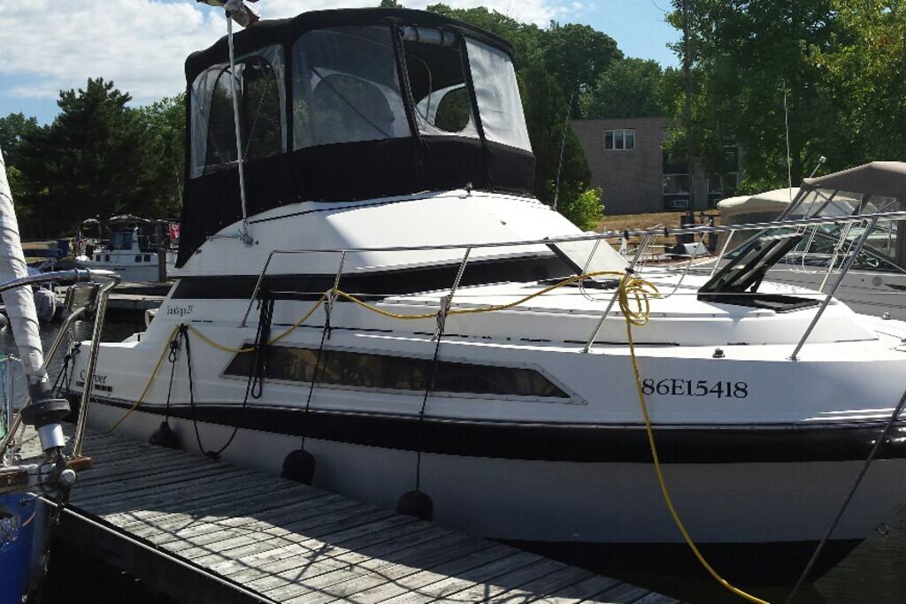 Securely berthed with shore power, hot and cold running water, lights , AC and heat. Guest showers and restroom facilities are a few steps away. Limited toilet facilities are on board.