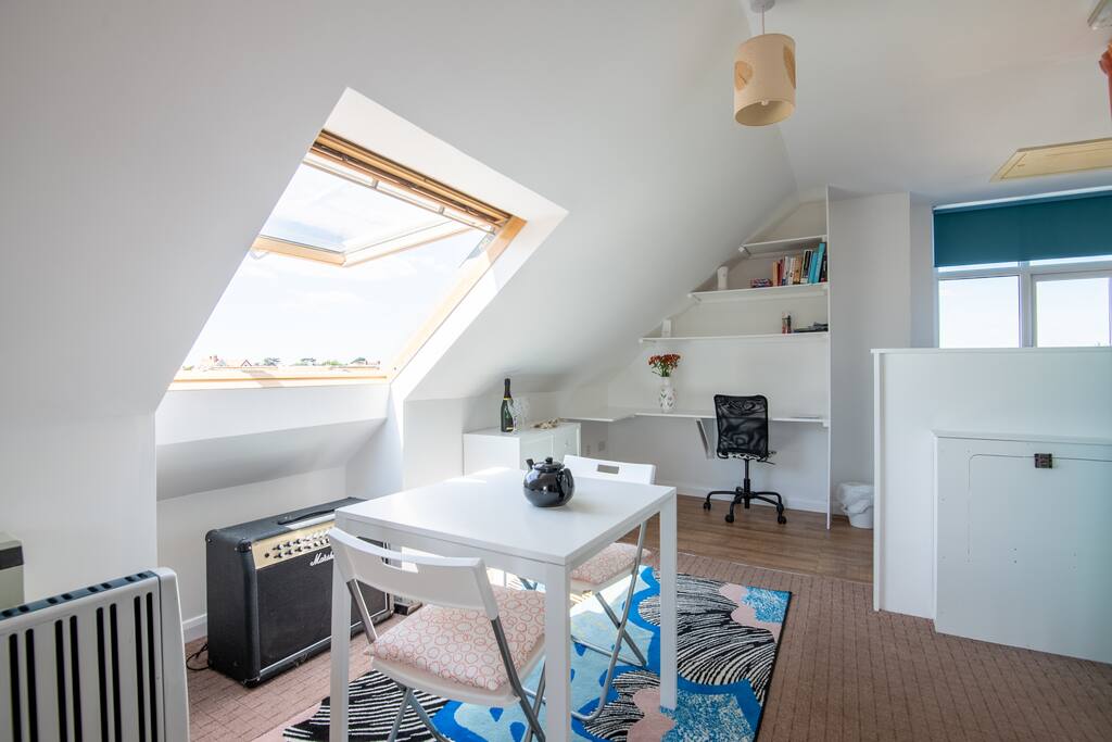 Velux windows, writing desk and dinning area