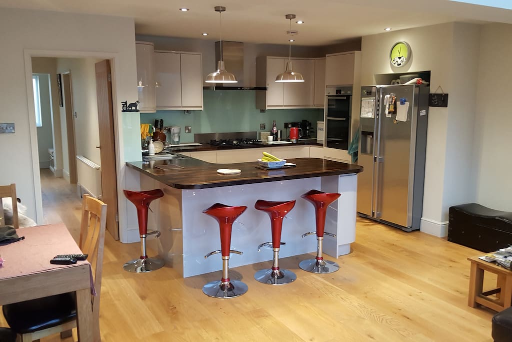 Contemporary kitchen with breakfast bar - perfect for preparing and cooking local Cotswold delicacies