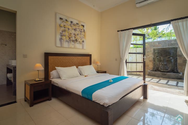 One of the four bedrooms in villa 1