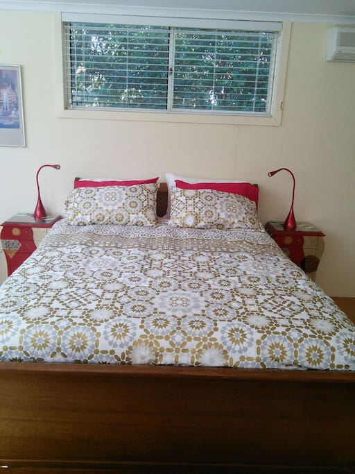 Comfortable queen bed with reading lights