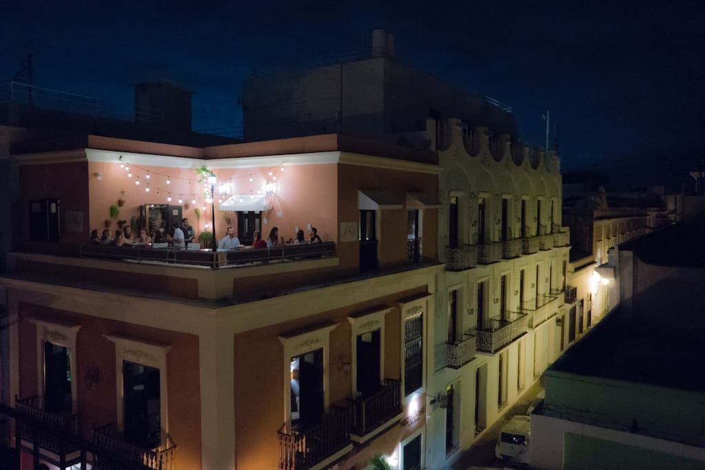 Photo of view FROM OUR BALCONY at night. Al Fresco pictured here.