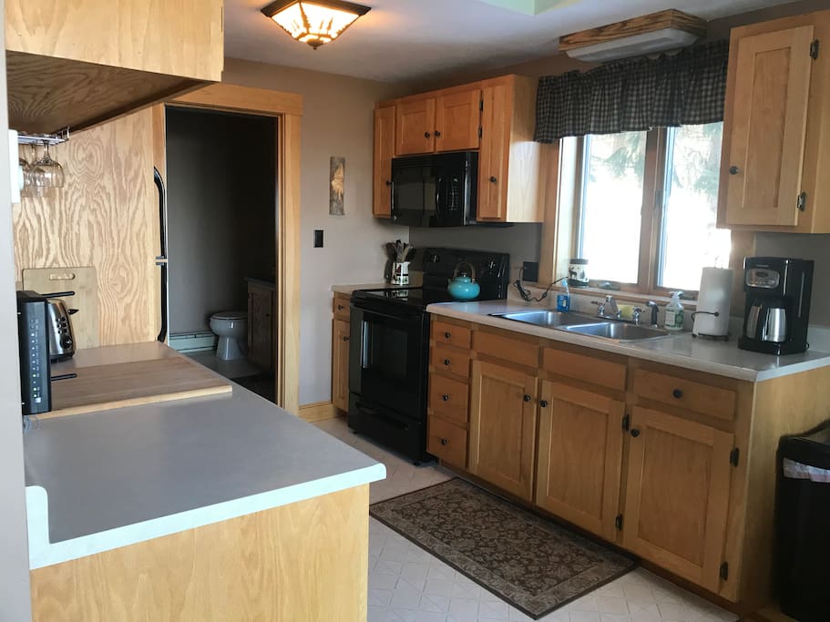 Well stocked kitchen with 1st floor bath off from kitchen - open floor plan