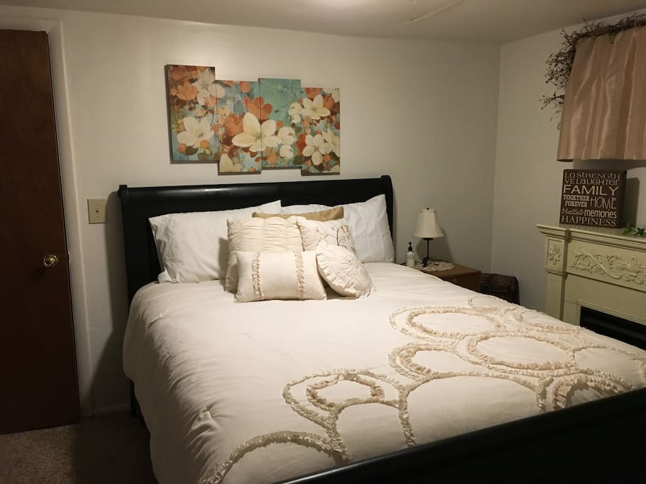 Queen bed with shared bathroom