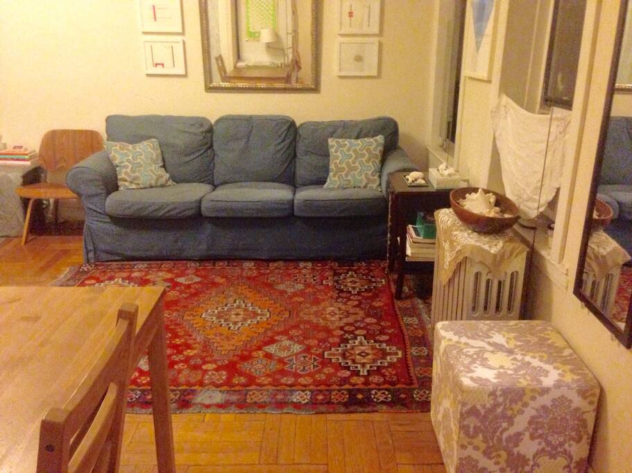 Multiple seating areas, uncommon for studio apartments.