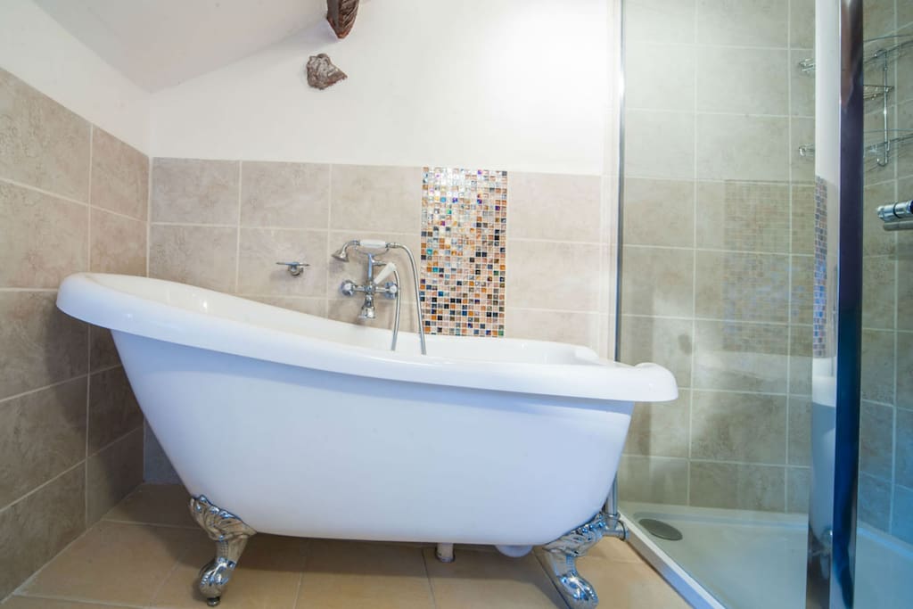 Brand new bathroom with slipper bath and shower unit