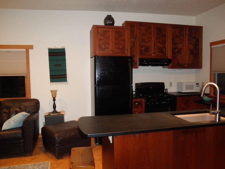 Kitchen is fully equipped. Cabinets are made of reclaimed redwood.