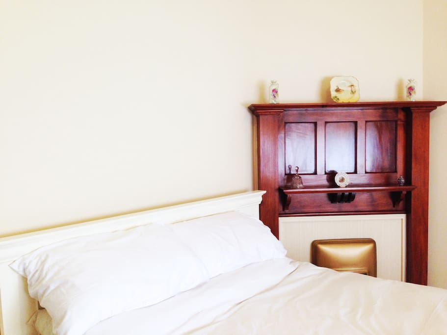 The master bedroom is spacious, with large bay windows