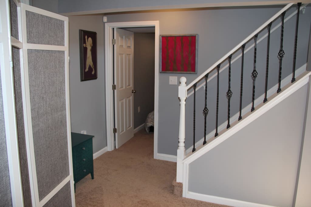 The door on the left is a cozy bedroom with a large closet and lockable door.