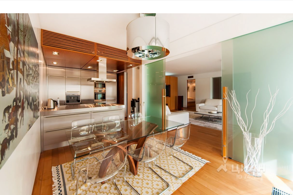 Kitchen and dining area opens up to living room through sliding glass doors